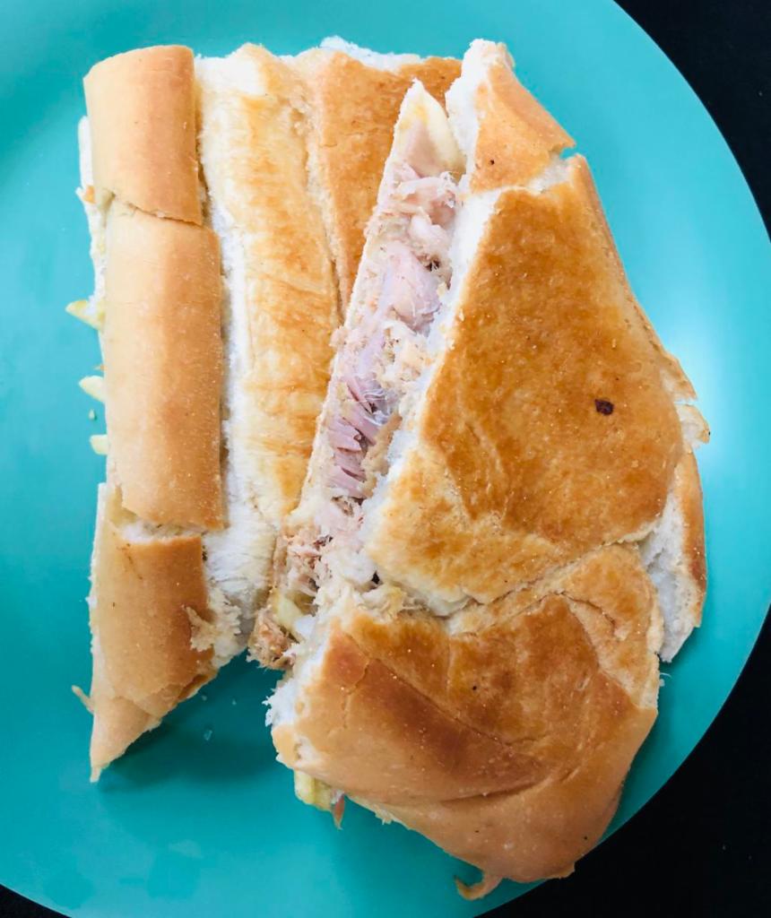 Lechon Sandwich · Roast pork sandwich. 