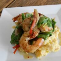 Shrimp & Grits · The original grit girl stone-ground grits, peppers and onions, baby spinach, and pot likker ...