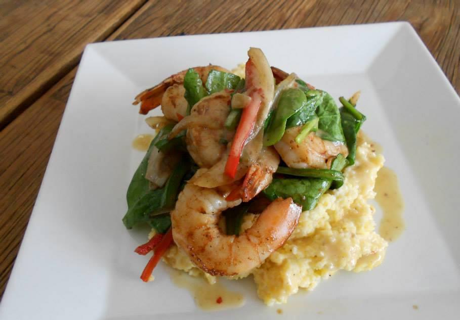 Shrimp & Grits · The original grit girl stone-ground grits, peppers and onions, baby spinach, and pot likker butter sauce.