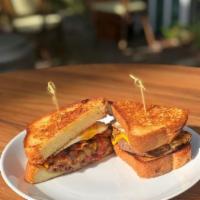 Breakfast Patty Melt · thick cut brioche, sirloin, american cheese, egg, bacon, caramelized onion + mayonnaise