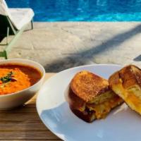 Tomato Soup & Grilled Cheese · Our Gourmet Grilled Cheese served with Hearty & Creamy Tuscan Tomato Soup