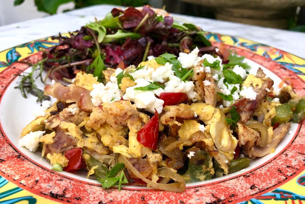 Smoked Chicken Scramble · Pulled smoked chicken, bell peppers, onions, feta cheese, fruit and green salad.