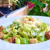 Caesar Salad · Romaine lettuce, croutons, Parmigiano, garlic-lemon dressing.