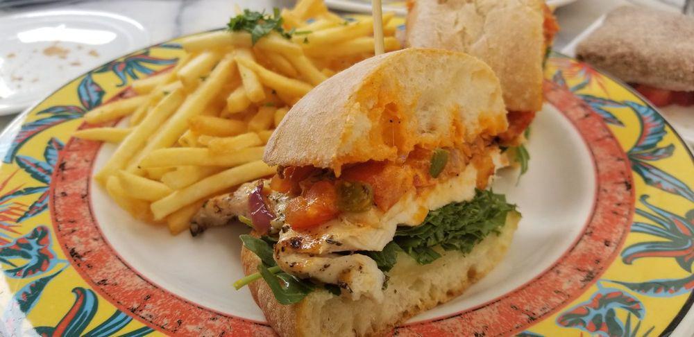 Grilled Chicken Sandwich · Bell peppers, onions, tomatoes, basil, arugula, fontina, red pepper aioli.