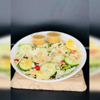 Green Bowl Salad · Organic mixed greens, romaine, baby arugula, cucumbers, grape tomatoes, shaved aged Parmesan...