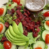 Spring Mix Salad · Organic mixed greens, grape tomatoes, cucumbers, dried cranberries, Hass avocado and balsami...