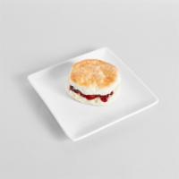 Biscuit with Raspberry Jam · Raspberry jam sandwiched between two slices of a warm and flaky biscuit.