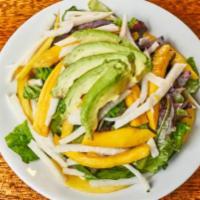 Tropicana Salad · Organic spring mix greens, mango, jicama, avocado and basil-cilantro dressing.