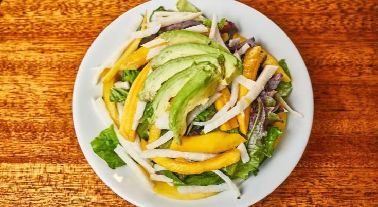 Tropicana Salad · Organic spring mix greens, mango, jicama, avocado and basil-cilantro dressing.