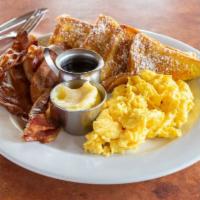 French Toast Combo · Two eggs cooked any style, two pieces of french toast and your choice of four strips of baco...