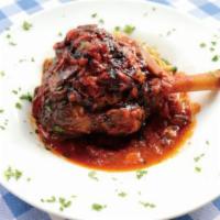 Lamb Shank Giouvetsi · Lamb shank oven baked with orzo, in tomato sauce.