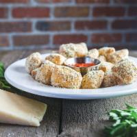 Polo Grounds Parm Bites · Our famous pizza dough (made fresh daily) tossed in Parry's Parmesan mix, served with homema...