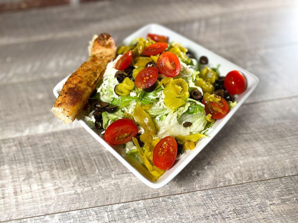 House Salad · Garden fresh mixed greens, pepperoncini, black olives and grape tomatoes, topped with Parry’s Parmesan mix, hand-grated mozzarella and Italian dressing. Served with a delicious breadstick.
