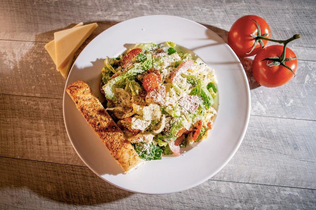 Italian Chopped Salad · Garden fresh mixed greens, fresh mozzarella, tomatoes, salami, pepperoni, marinated artichokes and croutons, tossed in our homemade Italian dressing with Parry’s Parmesan mix on top.