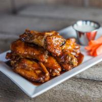 Buffalo Wings · Big, meaty chicken wings, never frozen, seasoned with our special mix of spices and tossed w...
