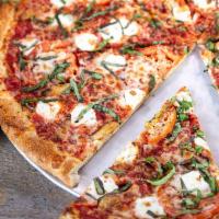 Not Yo Momma’s Margherita Pizza · Red sauce base roasted garlic cloves, sliced tomatoes, fresh mozzarella, fresh basil and Par...