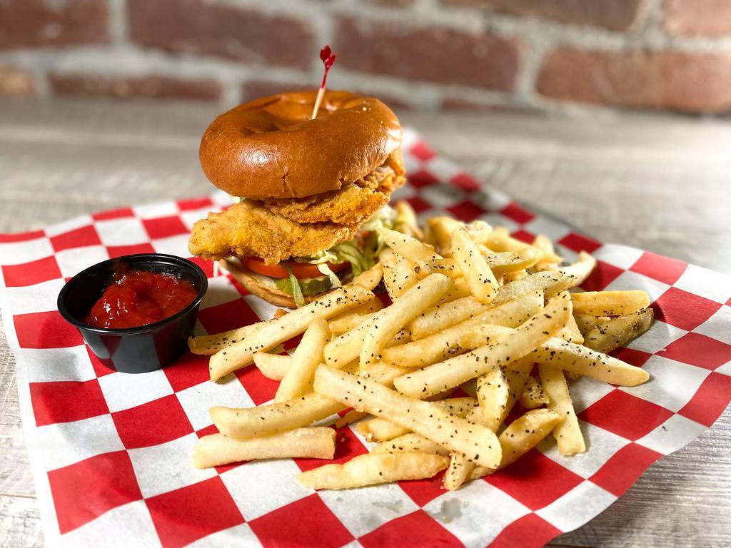 The Fried Chicken Sandwich · Hand-battered chicken, lettuce, tomato, pickles, mayonnaise. Get it Buffalo-style by adding Buffalo sauce to your chicken. Add melted American cheese, hand-grated mozzarella or blue cheese for an additional charge.