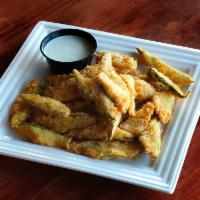 Fried Zucchini · Slices of deep-fried zucchini served with ranch.