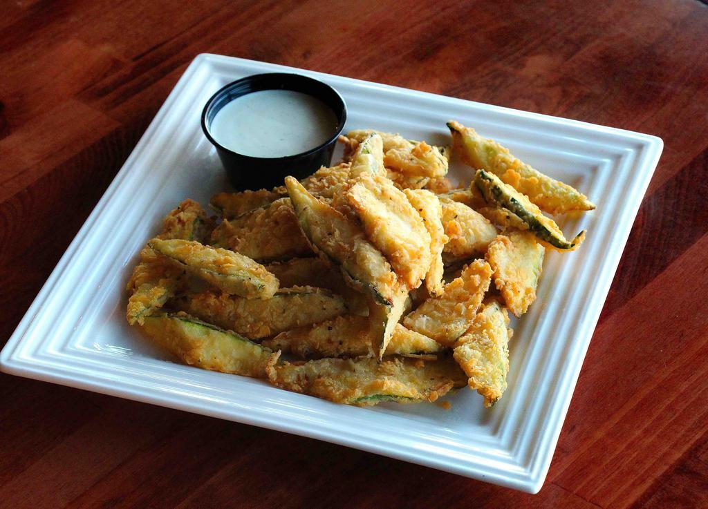 Fried Zucchini · Slices of deep-fried zucchini served with ranch.