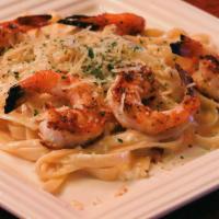 Shrimp Parmesan Pasta · Blackened shrimp tossed in fettuccine alfredo with parmesan cheese sprinkled on top and serv...