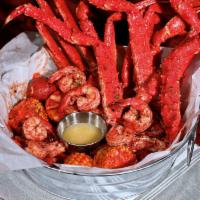 The Cluster Bucket · 1 lb. of king crab, 1 lb. of snow crab, and 1 lb. of jumbo shrimps. Served with corn and pot...