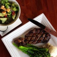 Ribeye · 12 oz. center-cut ribeye served with a loaded baked potato and a house salad with your choic...