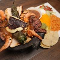 The Molcajete · A special stone bowl filled with salsa(bowl not included), surrounded
by 4 jumbo shrimp, chi...