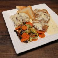 Chicken Fried Chicken · Tender, hand-battered chicken breast served with
roasted vegetables and garlic mashed potato...