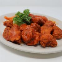 Wolfies Boneless Wings · Hand-battered boneless chicken breast pieces with your choice of sauce. Choice of ranch or b...