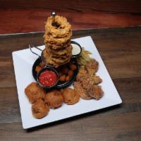 Party Sampler · Our towering onion rings, crab stuffed mushrooms, bone-in Buffalo wings, cheese curds, and f...