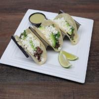 Tacos · 3 corn or flour tacos with your choice of chicken, beef or fish topped with diced onions, ci...