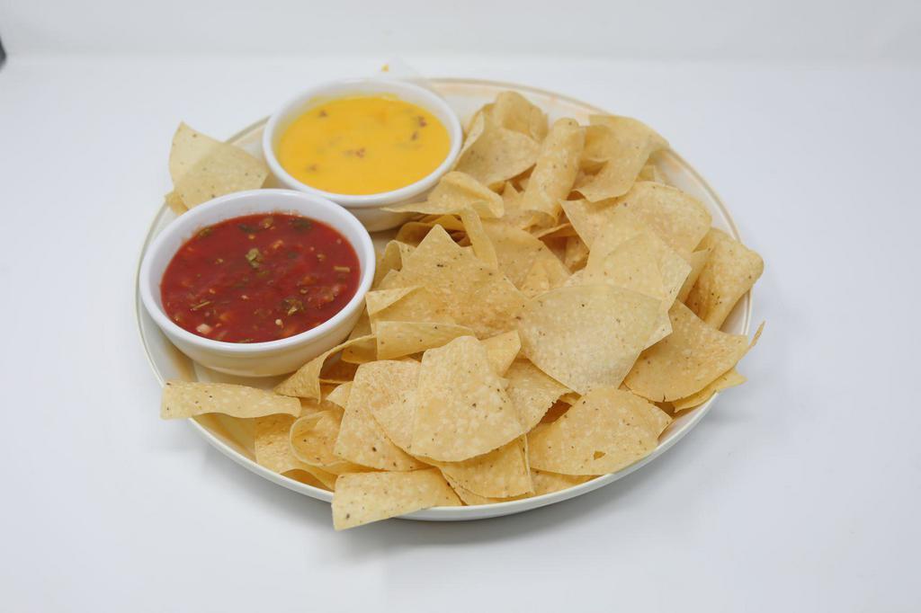 Chips & Queso · In-house queso with salsa and tortilla chips.
