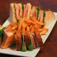 Club Sandwich · Turkey, bacon, ham, lettuce, Swiss cheese, tomatoes, and mayo all piled high on sourdough.