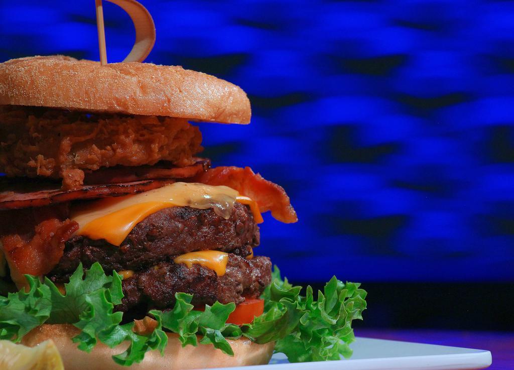 The Katy Burger · 2 all-beef patties, applewood smoked bacon, deli ham, a 3 cheese blend, lettuce, and tomatoes topped with an onion ring on our toasted steakhouse bun.