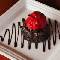Raspberry Hill · Molten lava cake topped with raspberry sorbet and drizzled with chocolate sauce.