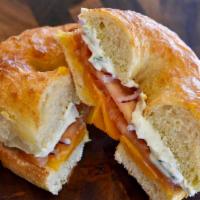 Bagel Melt  · Melted cheddar cheese, red onion, tomato, and chive cream cheese on a choice of toasted bagel.