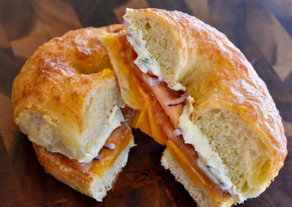 Bagel Melt  · Melted cheddar cheese, red onion, tomato, and chive cream cheese on a choice of toasted bagel.
