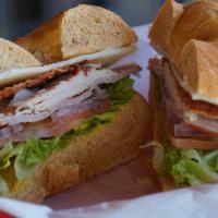 Club  · Turkey, ham, bacon, choice of cheese, lettuce, tomato, and onion on a choice of toasted bagel.