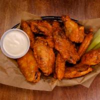 Classic Chicken Wings · 1 pound of jumbo chicken wings served with homemade dressing and celery.
