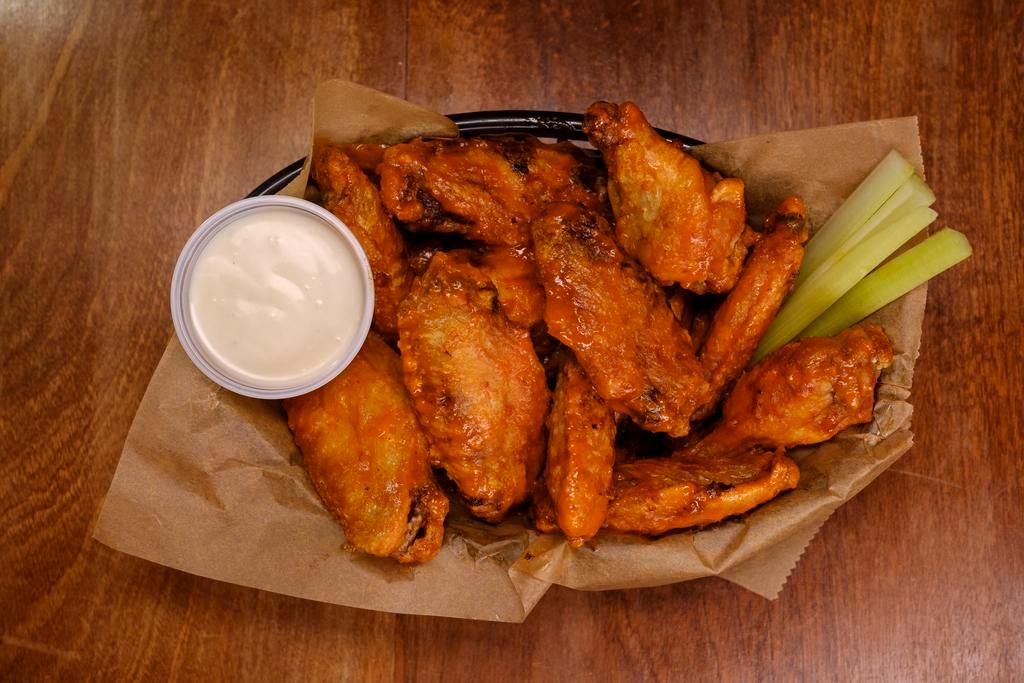 Classic Chicken Wings · 1 pound of jumbo chicken wings served with homemade dressing and celery.