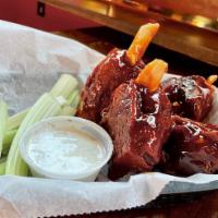 Pig Wings · 1 lb. bone-in pork shanks! Tossed in your choice of sauce, with ranch or blue cheese.