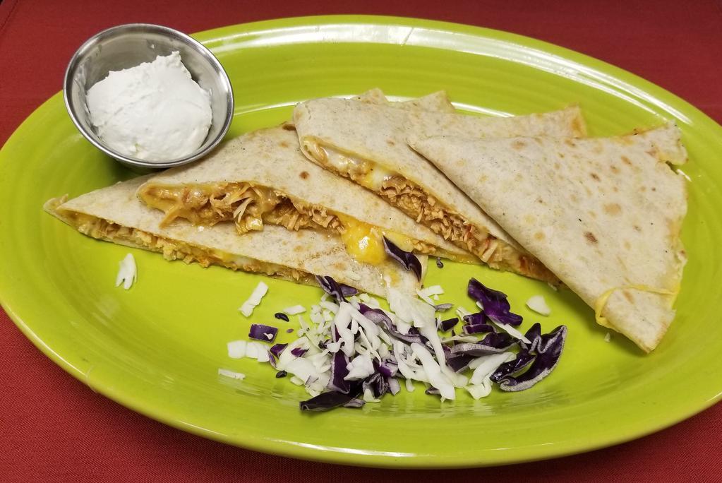 Tinga Chicken Quesadilla · Melted Monteray Jack and Cheddar cheeses and Tinga chicken in a warm flour tortilla.
