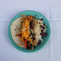 Veggie Taco · Seasonal vegetables and black beans topped with melted Mexican cheese.
