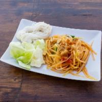 18. thai Papaya Salad · Som tum. Green papaya strips,  tomatoes, green bean, chili and peanut breaded in lime dressi...