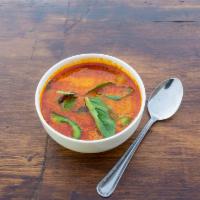 29. Red Curry · Red curry pasted with coconut milk, bamboo shoot, bell pepepr,green bean and basil. Spicy.
