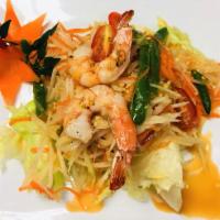 Papaya Salad · Som tom. Sliced green papayas, carrots, cashew nuts, and ground peanuts in a spicy and lime ...