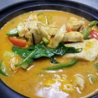 Yellow Curry (Gang Karee) · Traditional style yellow curry in coconut milk with potatoes and carrots. Topped with fried ...