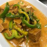 Panang Curry · Panang curry paste in coconut milk with Kafir lime leaves and bell peppers.