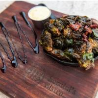 Brussels sprouts · duck bacon, garlic aioli, balsamic reduction