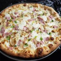 Chicken Divine Pizza Combo · White pizza with canadian bacon, broccoli, and chicken.